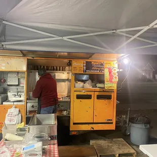 Owner cooking away...condiments to the left