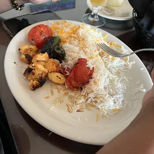 Chicken kebob the bland chicken was cold and it had jalapeño instead of grilled bell peppers and onions  so much rice over half the plate
