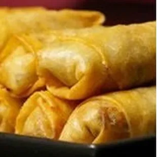 a plate of fried spring rolls