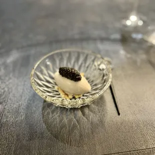 a dessert in a glass bowl on a table