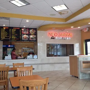 a man sitting at a table in a restaurant