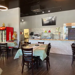 a restaurant with tables and chairs