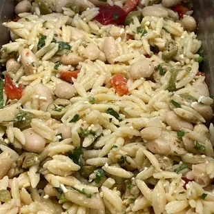 New! Orzollini Salad, Orzo and Cannellini beans tossed with herbs, feta cheese, green olives, red pepper in a spicy herbed lemon dressing!