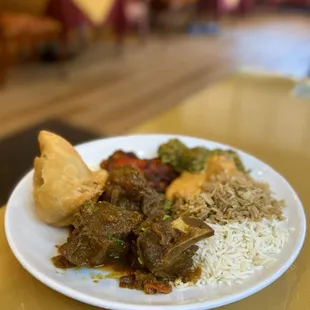 Lunch Buffet: Samosa, goat curry, chicken tikka masala, tandoori chicken, saag paneer, rice + biryani | $21.95