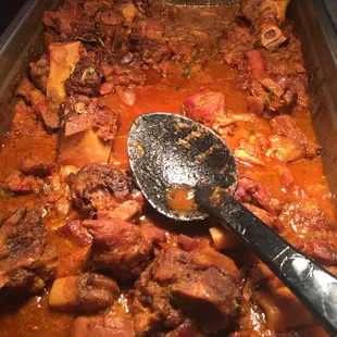 a pan of stew with meat and vegetables
