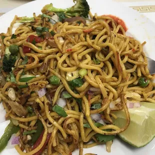 a plate of noodles and vegetables