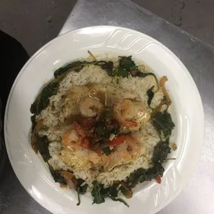 Turmeric Moscato Shrimp atop Rice wrapped in Spinach.