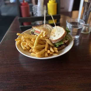 Chicken club sandwich and fries.