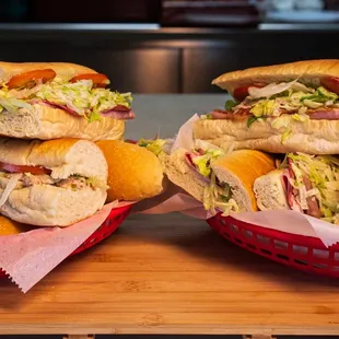 a stack of sandwiches on a cutting board