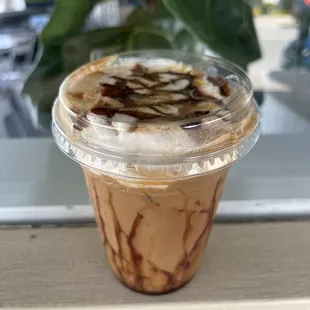 caramel swirl dirty chai with freshly whipped cream
