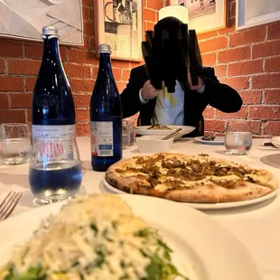 Delicious Pizza (mushrooms, artichokes, sausage and delish cheese)! Along with/an Arugula Salad that was very tasty!