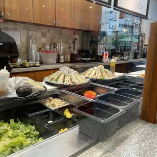 He's making sandwich party platters