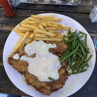 Chicken Fried Steak with fries.