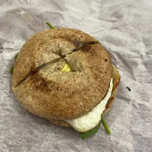 Spinach egg bagel breakfast sandwich