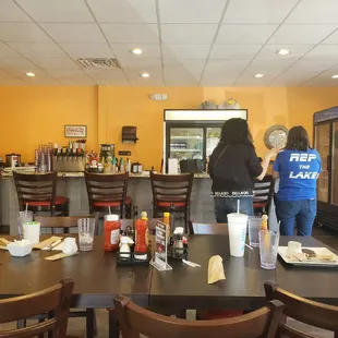 two people standing at the counter