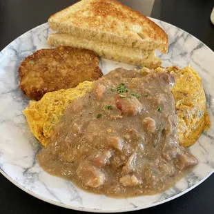 A-Z omelette (chorizo, red onions, pepperjack, green chiles, topped with their pork green chile sauce) potato pancake.