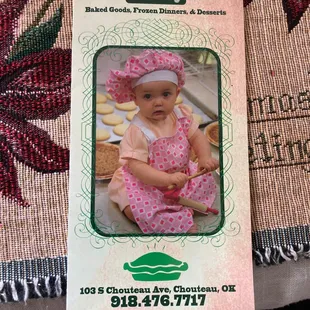 a baby in a pink dress