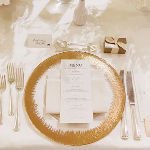 Formal place settings with a charger, custom menu, and utensils for each course, are perfect for elegant affairs.  PC:
 The Present Perfect