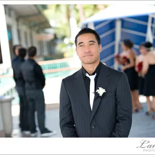 The groom awaits the arrival of his bride for the 1st time they see each other on the wedding day.  Photo by L&apos;Amour Photography