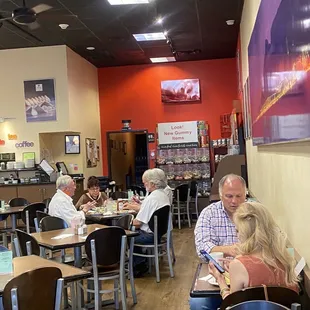 people sitting at tables eating