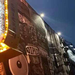 a neon sign on the side of a building