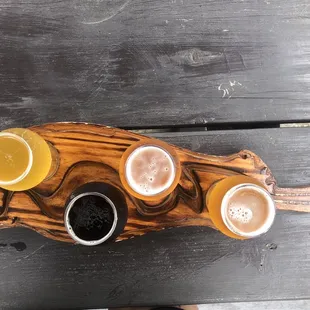 Beer flight on a cool board! Mango sour was my favorite.