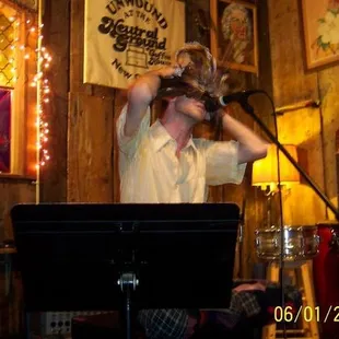 a man singing into a microphone