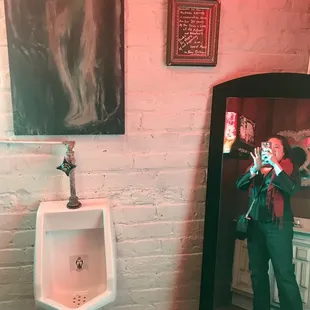 Full length mirror in unisex restroom