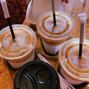 cappuccino and three iced lattes.