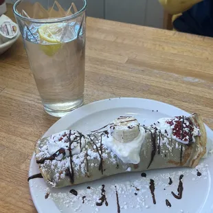 Nutella crepe, added bananas, strawberries and whip