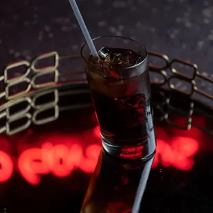 a drink in a glass with a straw