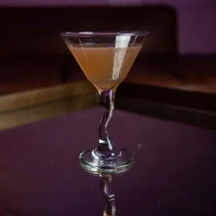 a glass with a liquid in it