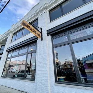 a brick building with a sign on it