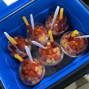 a blue container filled with fruit
