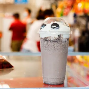 a milkshake in a plastic cup