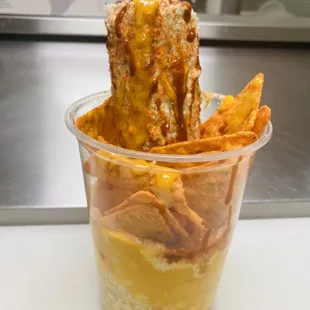 a dessert in a plastic cup