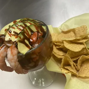 a bowl of guacamole and chips