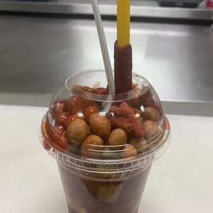 a plastic cup filled with nuts