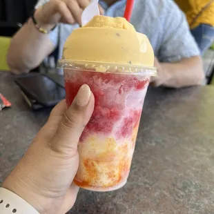 An Obispo, with mango  and strawberry , nuez  nieve and lechera also (lechera is condensed milk)