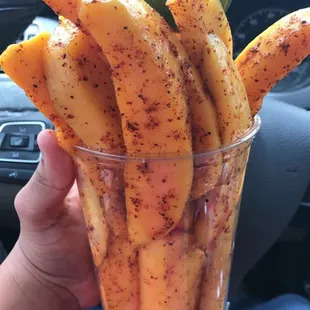 Large mango fruit cup with extra Tajin and limón.