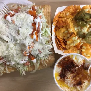 a plate of nachos and a bowl of salsa