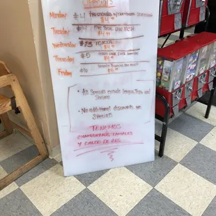 a whiteboard with red writing on it