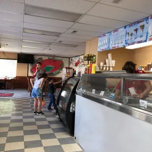 a line of people waiting in line to order food