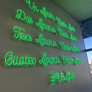 a neon sign on a wall