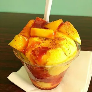 Chamango Chico $4. Mango ice cream, mango fruit, chamoy and tajin