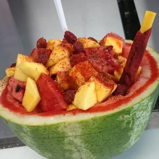 a watermelon filled with fruit