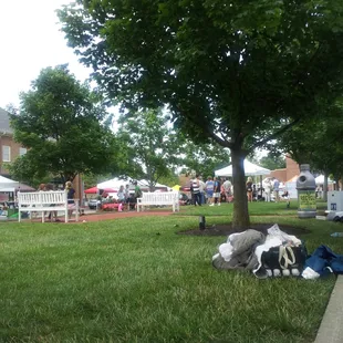 a stuffed cow laying in the grass