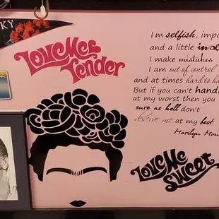 a pink refrigerator with a picture of elvis