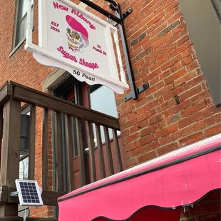 Look for the PINK awning.