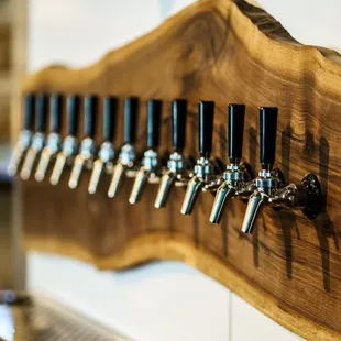 a row of beer taps